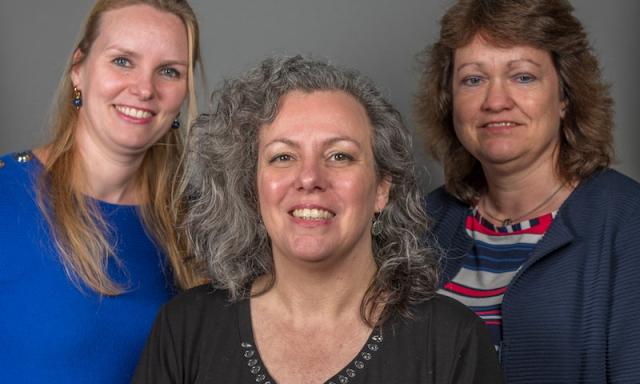 Drie IMD medewerkers.